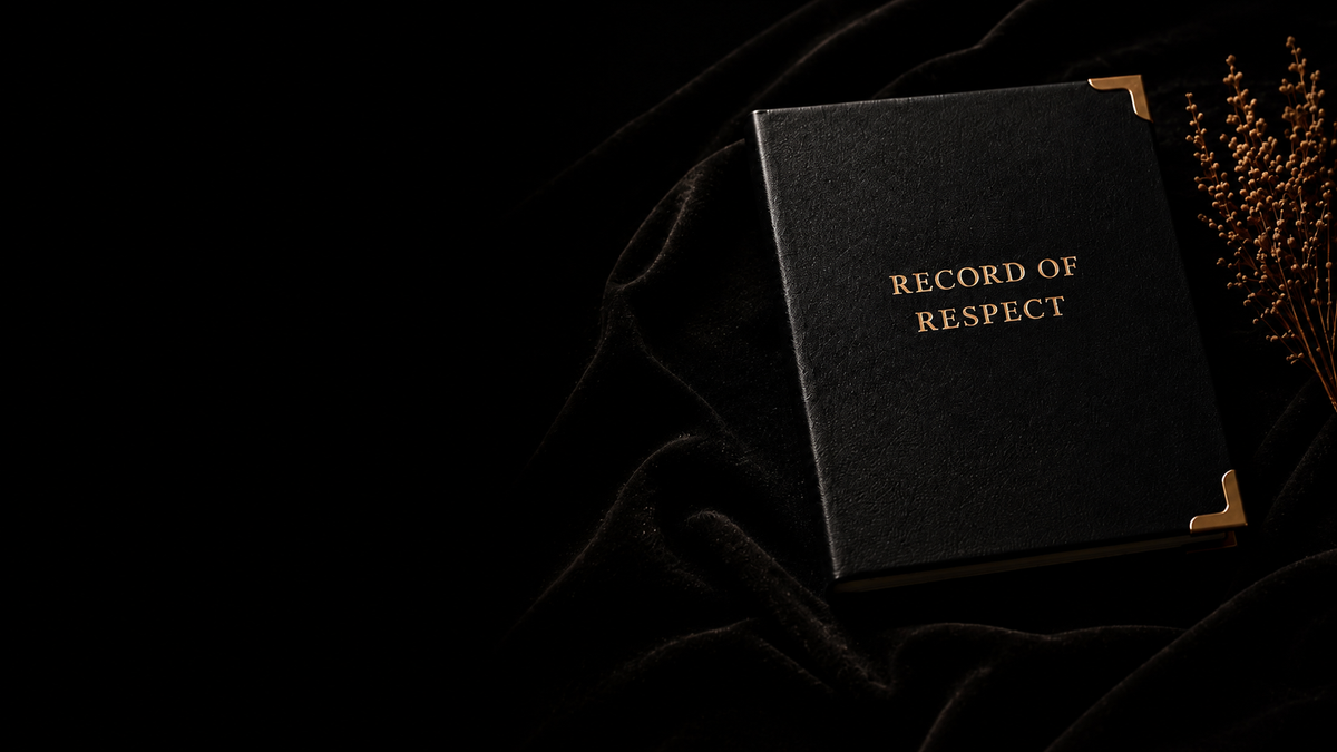 Record of Respect black leatherette album with gold corner protectors and gold foil title, resting on dark velvet beside dried golden flowers